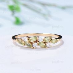 a yellow and white diamond ring sitting on top of a table