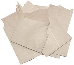 several pieces of white paper sitting on top of each other