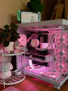 a pink computer case sitting on top of a wooden floor