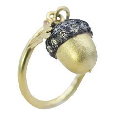 This sweet charm ring is perfect for stacking or an elegant little piece all on its own. Either way you'll love wearing it! The top of the acorn is oxidized sterling silver sprinkled with pave set white diamonds, the body of the acorn and the oak leaf are 18k yellow gold. Both pieces dangle gently from a round, slender 18k yellow gold band. Every piece of nature inspired fine jewelry by Rebecca Myers Design is made in-house at our studio in Baltimore, MD. Silver Sprinkles, Acorn And Oak, Oak Leaf, Charm Rings, Leaf Charms, Oxidized Sterling Silver, Baltimore, Gold Bands, Diamond White