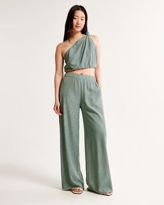 Ultra high rise ultra-wide leg pants in a breezy, crinkle textured fabric, featuring a pull-on style elasticated waistband for comfort and adjustability. Spring Wide-leg Pants With Crinkle Texture, Casual Summer Pants With Crinkle Texture, Chic Flowy Green Bottoms, Spring Wide-leg Crinkle Texture Pants, Chic Green Flowy Bottoms, Summer Wide Leg Pants With Crinkle Texture, Summer Wide Leg Crinkle Texture Pants, Chic Spring Bottoms With Crinkle Texture, Summer Wide Leg Bottoms With Crinkle Texture