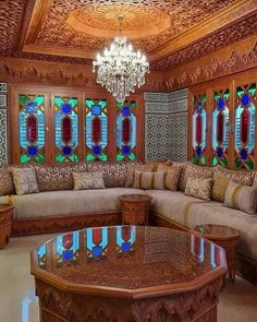 a living room filled with furniture and stained glass windows