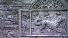 a stone carving on the side of a building