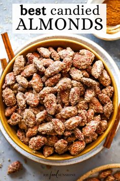 the best candied almonds in a bowl with cinnamon sticks