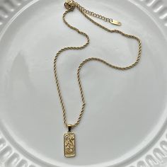 gold rectangle pendant with gold strength cheetah detailing 

about 16-18”
steel chain 

gold jewelry 
gold necklace 
statement necklace 
vintage necklace 
vintage jewelry Jewelry Gold Necklace, Rectangle Pendant, Necklace Statement, Chain Gold, Necklace Vintage, Jewelry Gold, Steel Chain, Vintage Necklace, Women's Jewelry