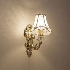 a wall light with a glass shade on it