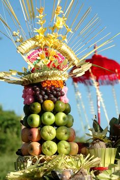 an arrangement of fruits and vegetables on top of each other