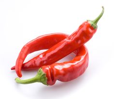 two red hot peppers on a white background