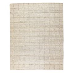 a white rug with squares and lines on the bottom, it is made out of wool