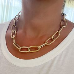 This Italian handcrafted chain link necklace is completely composed of 14K solid gold and is uniquely made with a semi-hollow interior for comfortable everyday wear that will not dent. NOTE: This item is available in longer or shorter length options. Kindly email us for pricing and details. Total Length: available in your choice of 14, 16, 18, 20, 22, 24, 26 or 30 inches Total Gram Weight: 18" length comes out to approximately 33.8 grams of 14K solid gold Link Dimensions: approximately 14mm (W) Yellow Gold Chunky Chain Jewelry With Oval Links, Gold-tone Oval Link Paperclip Chain Jewelry, Gold-tone Jewelry With Oval Link Paperclip Chain, Gold Oblong Jewelry With Adjustable Chain, Gold-tone Oval Jewelry With Gold Chain, Gold Chunky Chain Oval Jewelry, Gold Oblong Chain Jewelry, Gold Jewelry With Chunky Chain In Oval Shape, Gold Jewelry With Chunky Chain And Oval Shape