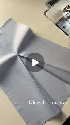 the video shows how to make a satin table runner