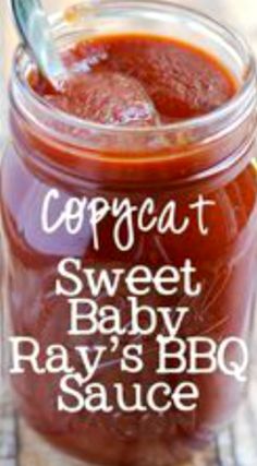 a jar filled with baby ray's bbq sauce on top of a table