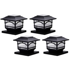 four black outdoor post lights with clear glass panels on each end and one light in the middle