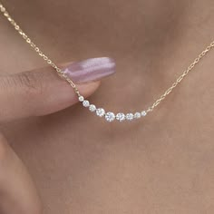 Elevate your style with our dainty 14k Curved Bar Diamond Necklace. This minimalist and handcrafted piece features a delicate bar pendant adorned with sparkling diamonds, making it the perfect wedding gift for her. Embrace the elegance and timeless beauty of this handmade diamond jewelry. Order now and make a statement of sophistication! Alternatively, choose from our options of natural, lab-grown diamonds or dazzling moissanites at three different price points to fit your unique preferences and budget. Please check below to see specifications of each stone option. Each piece is accompanied by an Azalea Certification and Warranty document, ensuring that you receive a high-quality, authentic piece of fine jewelry. Please message us if you don't receive your certification with your piece. M Luxury Minimalist Diamond-shaped Jewelry, 3 Diamind Necklace Horizontal, Diamond Necklaces Design, Luxury Dainty Diamond Necklace With Baguette Diamonds, Lab Diamond Necklace, Everyday Diamond Jewelry, Dainty 14k Gold Bar Necklace Gift, Silver Dainty Diamond Necklace, Delicate 14k Gold Bar Necklace