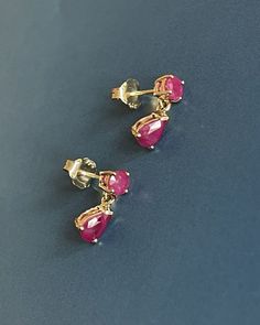 9ct Yellow Gold Ruby Earrings Pear Drop Studs 1.20ct 6x4 mm pear cut set with round cut combined carat 1.20ct Deep shade of pink red Ruby for coloured gems lover Hallmarked 9ct 375 Just under 2g Please see pics for measures "Free Next-day UK Delivery Safe, secure and insured delivery from our reliable delivery partners "What You See is What You Get" Promise Every photo you see is of the actual item. No trick lighting or editing" Classic Pink Drop Jewelry, Classic Pink Pear Shaped Jewelry, Classic Pink Pear-shaped Jewelry, Ruby Earrings Gold, Studs Gold Earrings, Gold Ruby Earrings, Red Ruby Earrings, Coral Jewelry Set, Ruby Stud Earrings