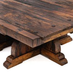 an old wooden table with two legs and one leg missing the top, on a white background