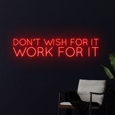 a neon sign that says don't wish for it work for it on the wall