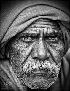 black and white photograph of an old man wearing a turban