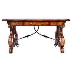 an old wooden table with two drawers on one side and wrought iron handles on the other