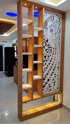 a room divider with shelves and lights in it