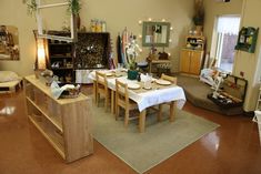 a living room filled with furniture and lots of clutter on top of a rug