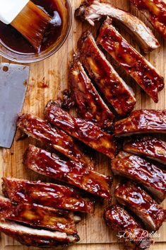 bbq ribs and barbecue sauce on a cutting board