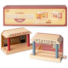 a wooden toy set with a building and sign in front of the box that says repair station