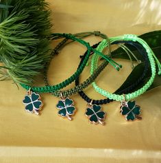 These St. Patrick's Day bracelets make a great compliment to any outfit to celebrate this special holiday!   Show your fun spirit for this inclusive holiday because everyone is Irish on St. Patty7's Day! These make great gifts for your friends and loved ones to have matching bracelets to wear the whole month of March. The listing is for one bracelet in your choice of 4 different shades of green.  It is made with durable nylon string.  In the center of the bracelet is a fun and pretty shamrock ch Shamrock Bracelet, Green Bracelet, Lucky Bracelet, Irish Jewelry, Different Shades Of Green, Four Leaf, Matching Bracelets, Leaf Clover, Braided Bracelets