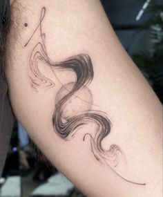 a woman's arm with a tattoo on it that looks like she is holding a fishing rod