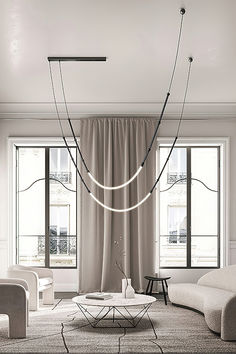 a living room filled with white furniture and large window covered in drapes, along with a circular chandelier hanging from the ceiling