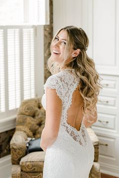 a woman in a wedding dress looking back