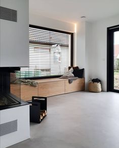 a living room with a fireplace and sliding glass doors