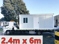 a white truck is parked next to a yellow van and trees in the background with a sign that says 2 4m x 6m