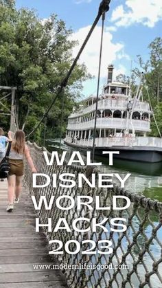 people walking across a bridge over water with a boat in the background that says walt disney world hacks 205