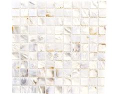 a white tile wall with square and rectangle tiles on the bottom, in shades of beige