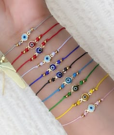 Links to bracelets: #2 https://www.etsy.com/listing/1516996437 #3 https://www.etsy.com/listing/1517006795 #4 https://www.etsy.com/listing/1502821264 🇺🇸 Handmade to order in the U.S 💫 Adjustable and hypoallergenic. - Choose from the variety of colors from our other listings. The evil eye / mal de ojo / Nazar is a shield that guards against various forms of bad luck that is willed onto you or an object by others. It is believed that if your evil eye cracks or breaks it has done its job of prote Evil Eye String Bracelet, Evil Eye Jewelry Diy, Evil Eye Jewelry Bracelet, Royal Family Portrait, Diy Bracelet Designs, Beads Bracelet Design, String Bracelet, Evil Eye Bracelet, Evil Eye Jewelry