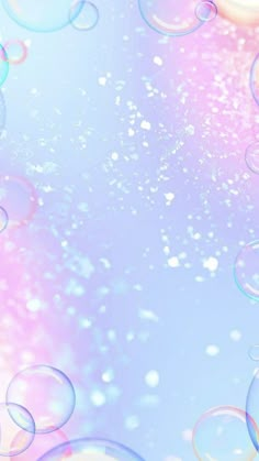 soap bubbles floating in the air on a blue and pink background