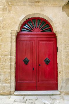 a red door with an arch above it