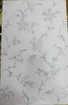 a piece of paper that has been drawn on top of some kind of table cloth