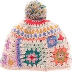 a multicolored crocheted hat with a pom - pom