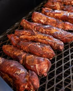 some meat is cooking on a grill and it looks like they have been grilled