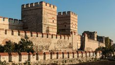 an old castle with brick walls and towers