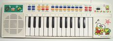 an electronic keyboard with cartoon characters on it