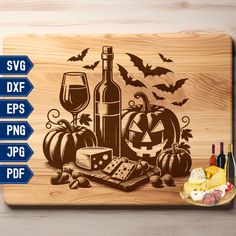 a wooden cutting board with wine, cheese and pumpkins