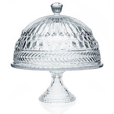 a clear glass cake dish with a domed cover on the top and bottom, set against a white background