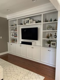 a living room with built in entertainment center