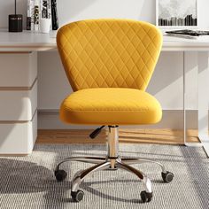 a yellow office chair sitting in front of a desk