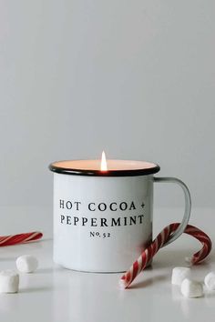 Our limited-edition Hot Cocoa + Peppermint Mug Candle smells just like a fresh cup of hot chocolate mixed with a candy cane! The best scents of the season blended into this perfectly balanced scent. It's the perfect Christmas gift for all the mint chocolate lovers in your life! When the candle has burned through all of the wax, you can remove the label and clean out the inside to repurpose it! Our sustainable mug candle can be repurposed as a coffee mug, planter, pen holder, etc.! It's perfect f Coffee Mug Planter, Peppermint Candle, Best Scents, Mug Candle, Peppermint Candles, Hostess Gifts Thanksgiving, Thanksgiving Hostess, Cup Of Hot Chocolate, Candle Smells