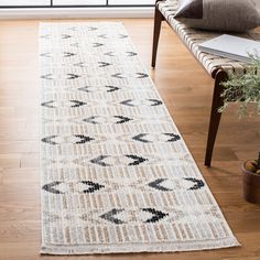 a white and black runner rug in a living room