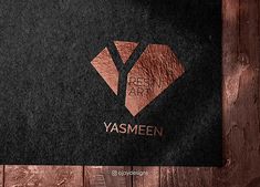 a black and brown business card with the words yasmeen on it